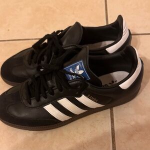Black Adidas sneakers samba